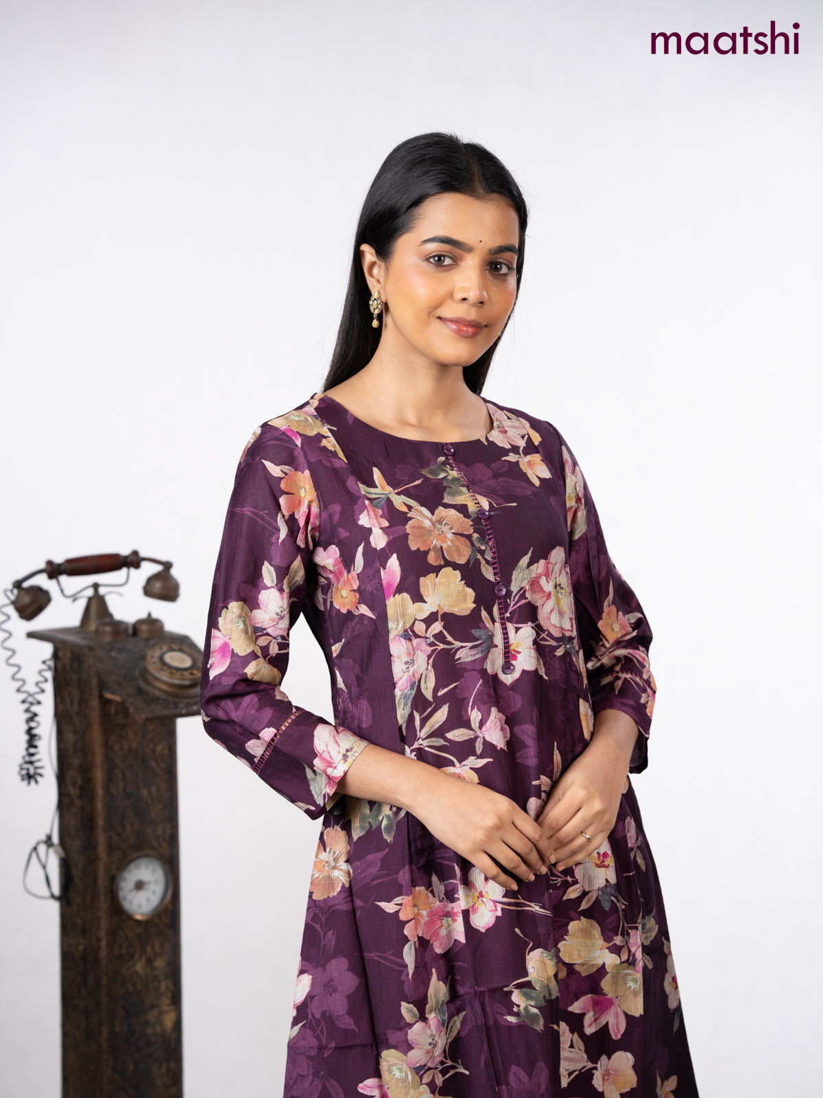Rayon a-line kurti wine shade with allover floral prints & simple neck pattern without pant