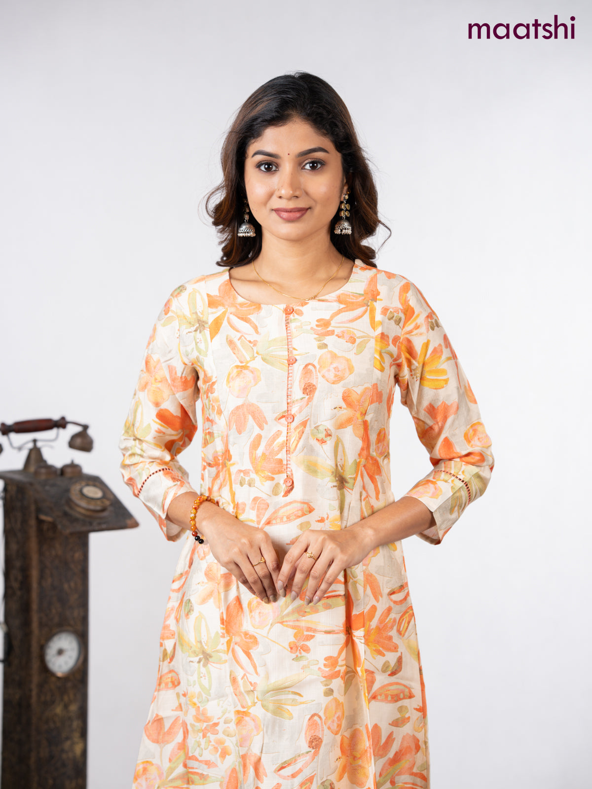 Rayon a-line kurti cream with allover floral prints & simple neck pattern without pant