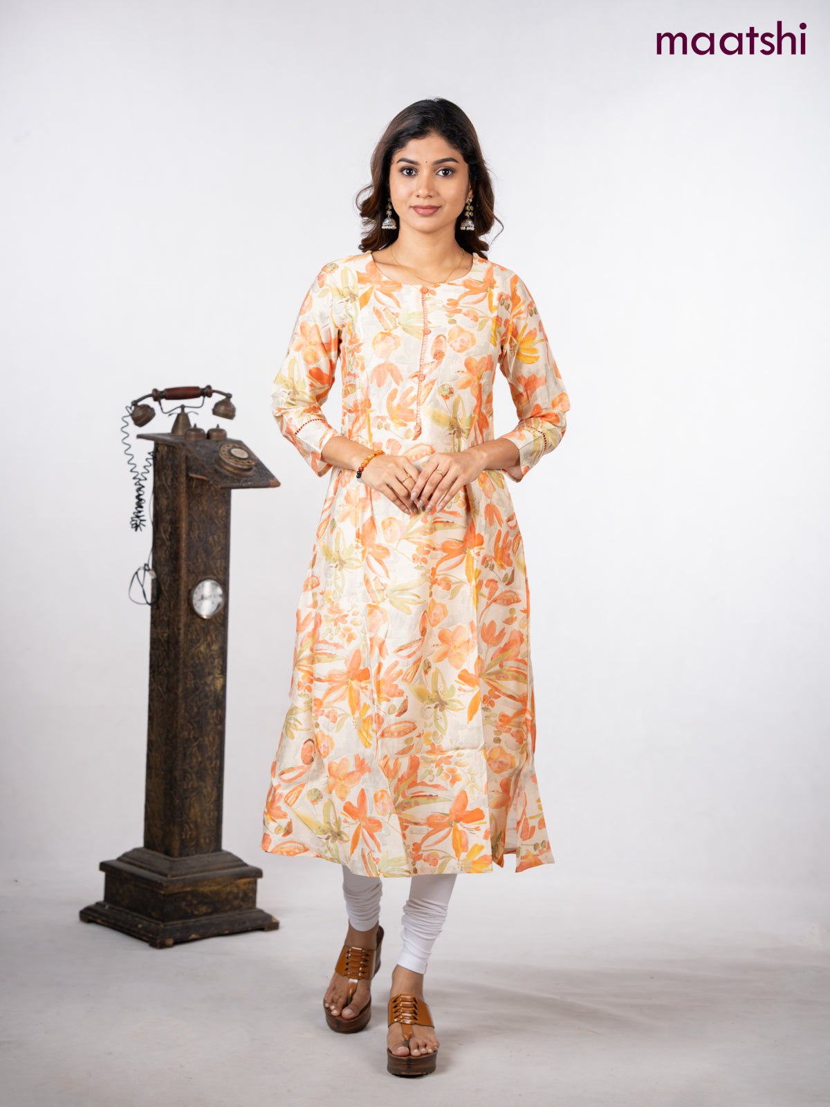 Rayon a-line kurti cream with allover floral prints & simple neck pattern without pant