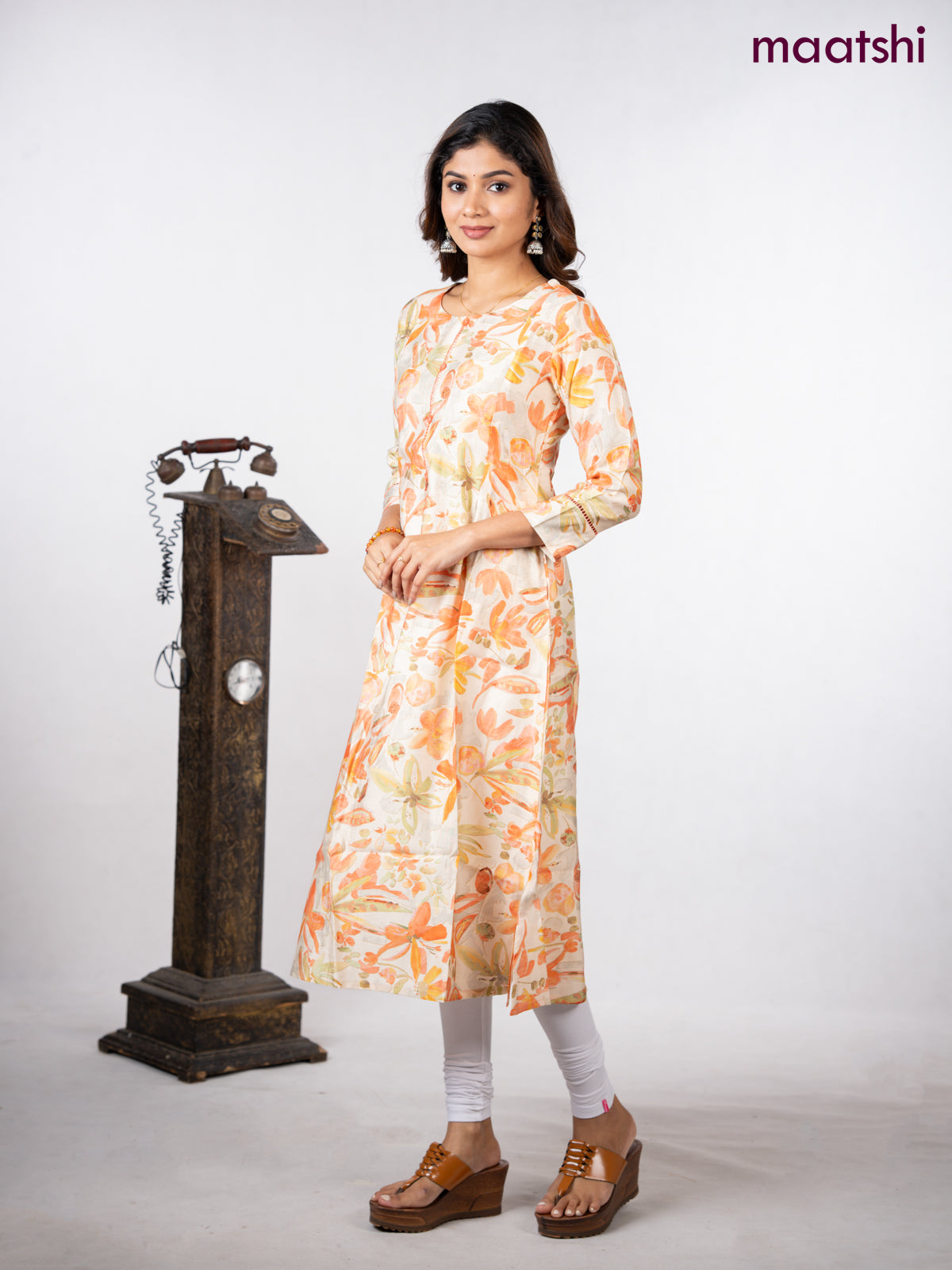 Rayon a-line kurti cream with allover floral prints & simple neck pattern without pant