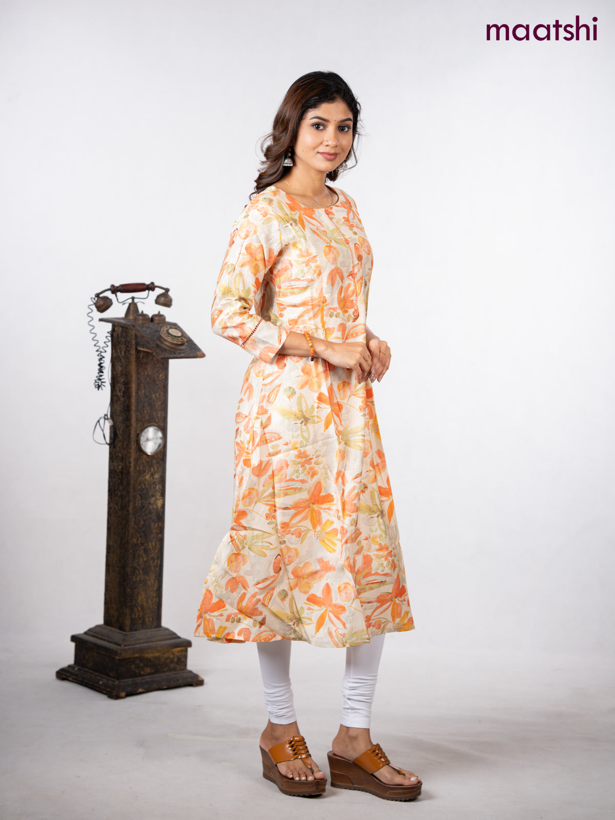 Rayon a-line kurti cream with allover floral prints & simple neck pattern without pant