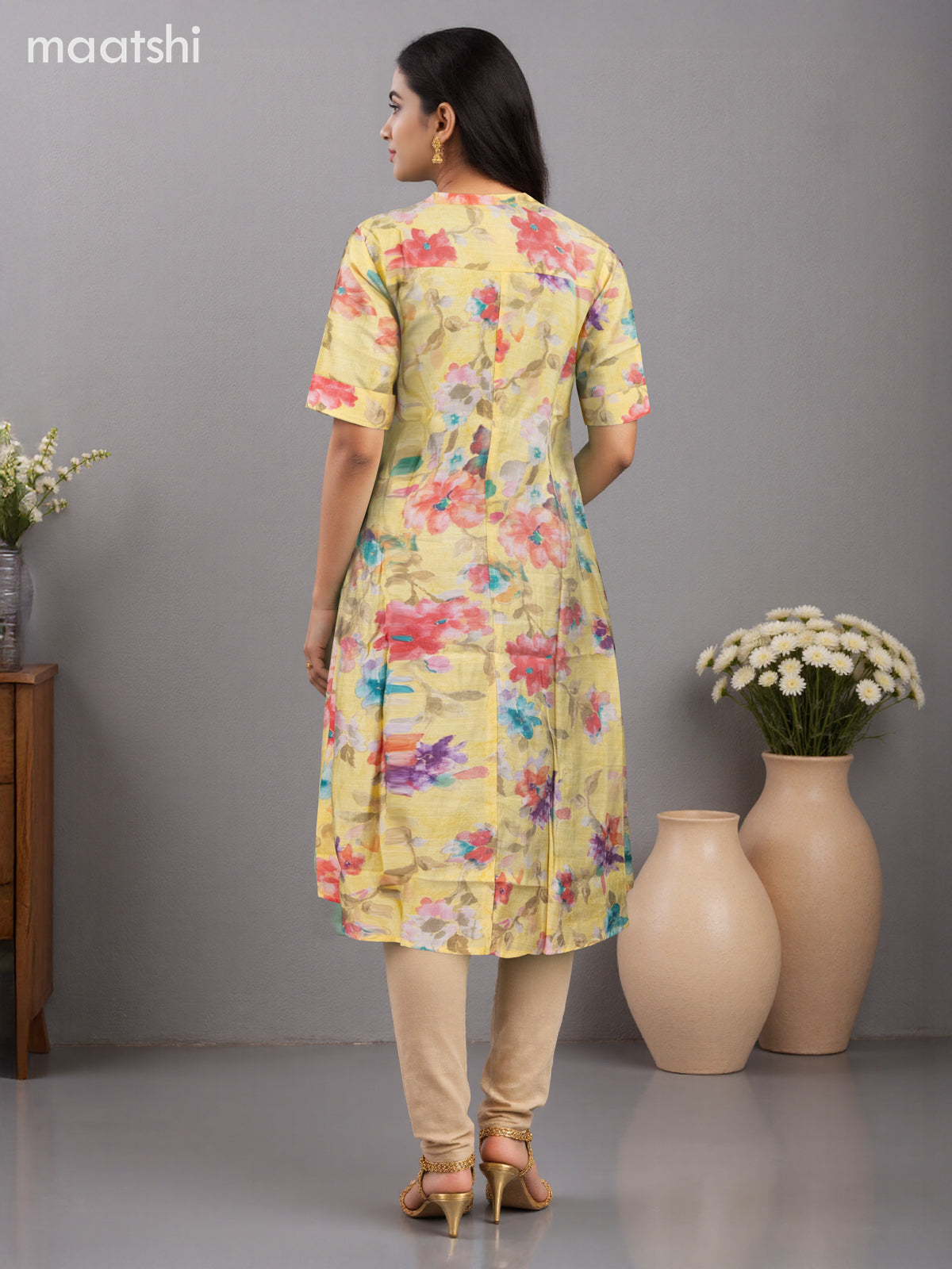 Rayon anarkali kurti pale yellow with allover floral prints & simple neck pattern without pant