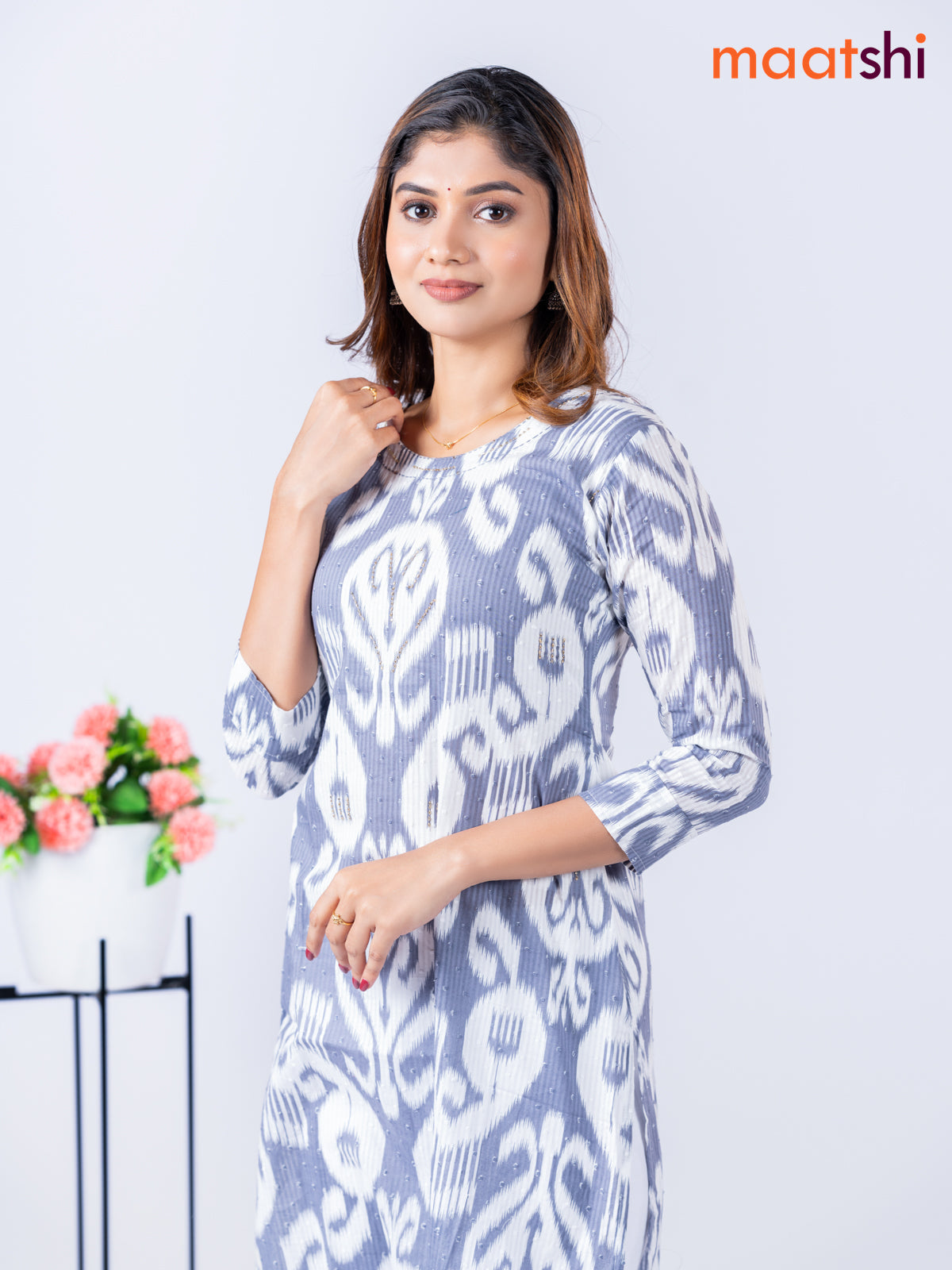 Cotton kurti with allover ikat weaves & beaded work neck pattern without pant