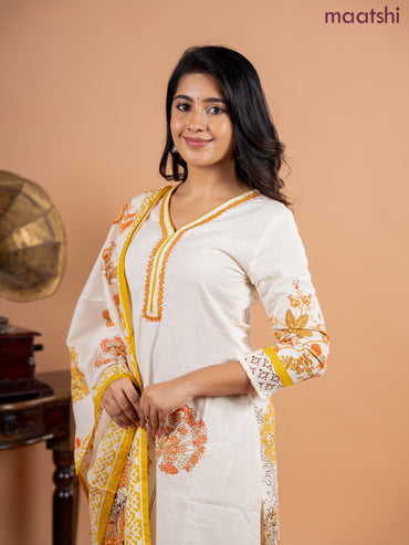 Placement salwar suit cream and mustard shade with prints & embroidery beaded work v neck pattern and straight cut pant & printed dupatta