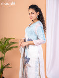 Placement print salwar suit off white and light blue with prints & embroidery sequin work v neck pattern and straight cut pant & dupatta