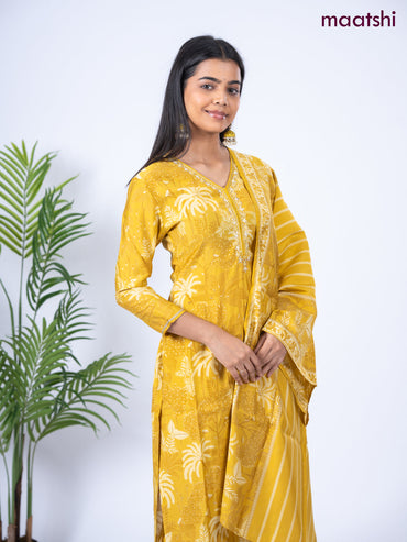 Crepe salwar suit mustard yellow with allover floral prints & embroidery sequin work v neck pattern and straight cut pant & dupatta
