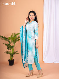 Placement print salwar suit off white and teal blue with prints & embroidery sequin work v neck pattern and straight cut pant & dupatta