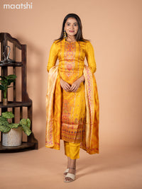 Banarasi silk salwar suit mustard yellow with allover prints & zardosi work neck pattern and straight cut pant & dupatta