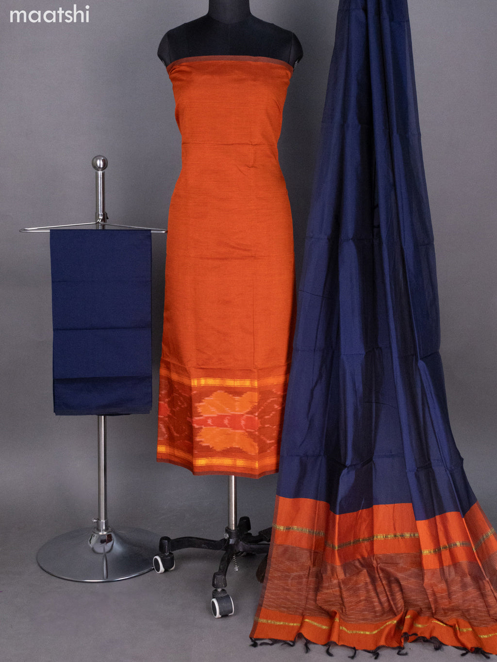 Rust Shade and Navy Blue Ikat Dress Material With Ikat Weaves