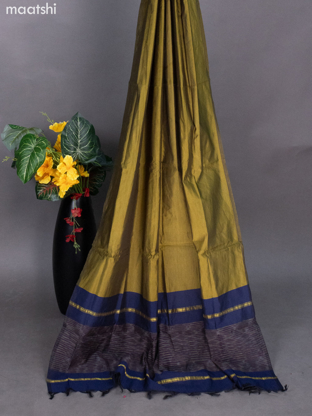 Navy Blue and Mehendi Green Ikat Dress Material With Ikat Weaves