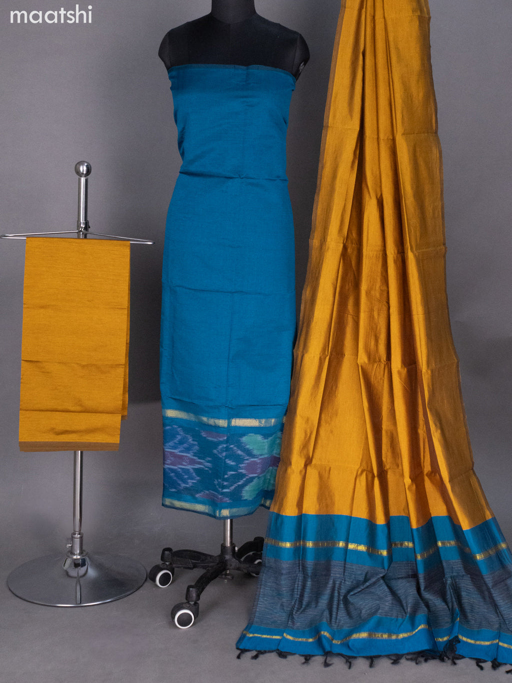 Peacock Blue and Mustard Shade Ikat Dress Material With Ikat Weaves