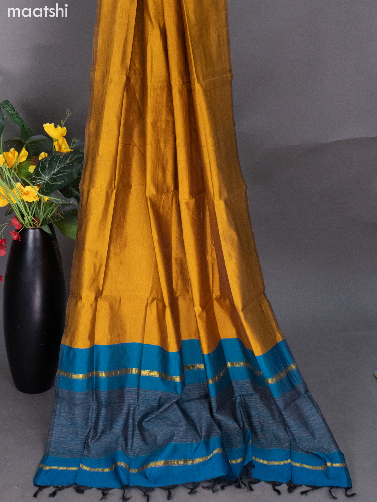 Peacock Blue and Mustard Shade Ikat Dress Material With Ikat Weaves
