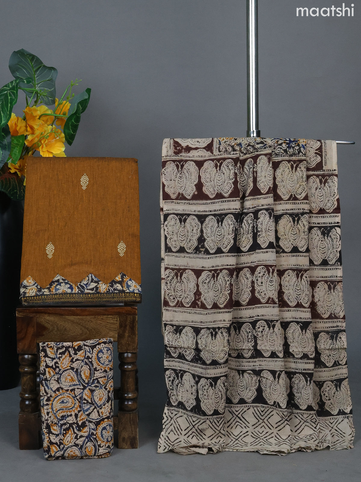 Mustard Shade and Black Beige Cotton Dress Material With Printed Buttas