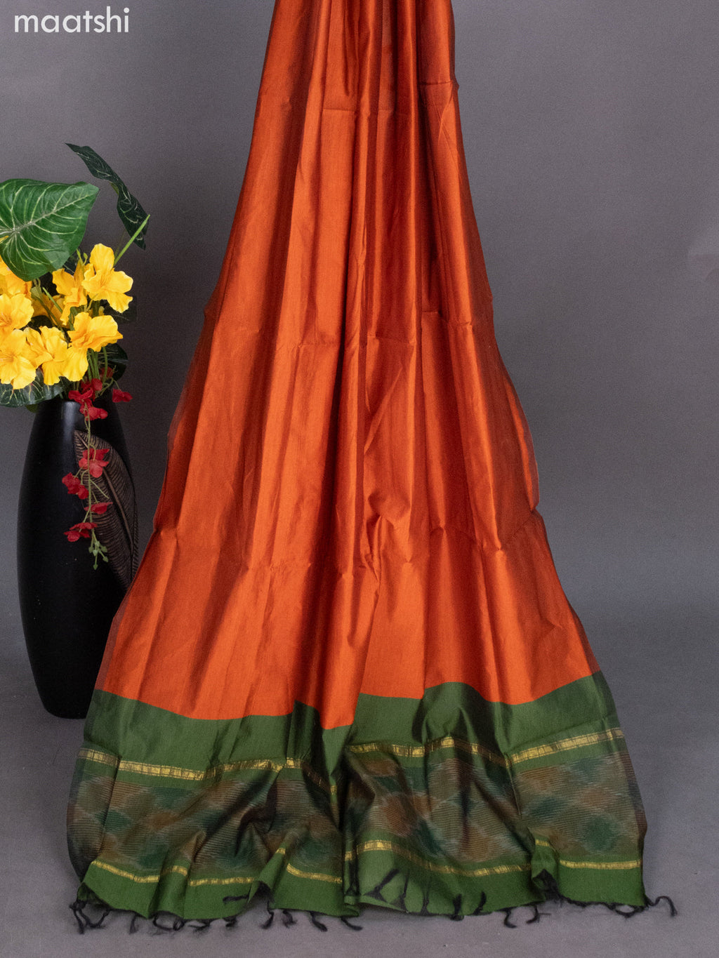Sap Green and Rust Shade Ikat Dress Material With Allover Ikat Weaves