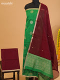 Green and Maroon Semi Silk Cotton Dress Material With Zari Buttas and Bottom & Dupatta