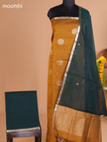 Mustard Yellow and Dark Green Semi Silk Cotton Dress Material With Zari Buttas and Bottom & Dupatta