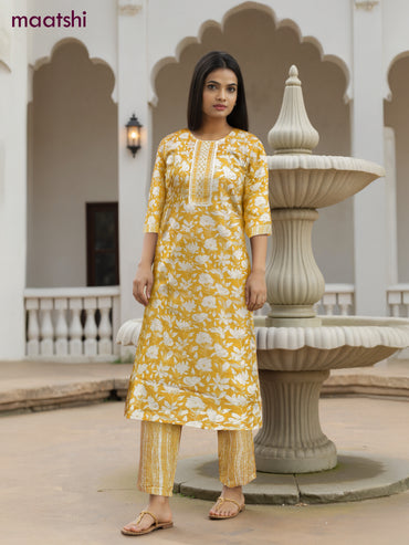 Cotton salwar suit yellow and off white with allover floral prints & mirror embroidery work neck pattern and straight cut pant & dupatta