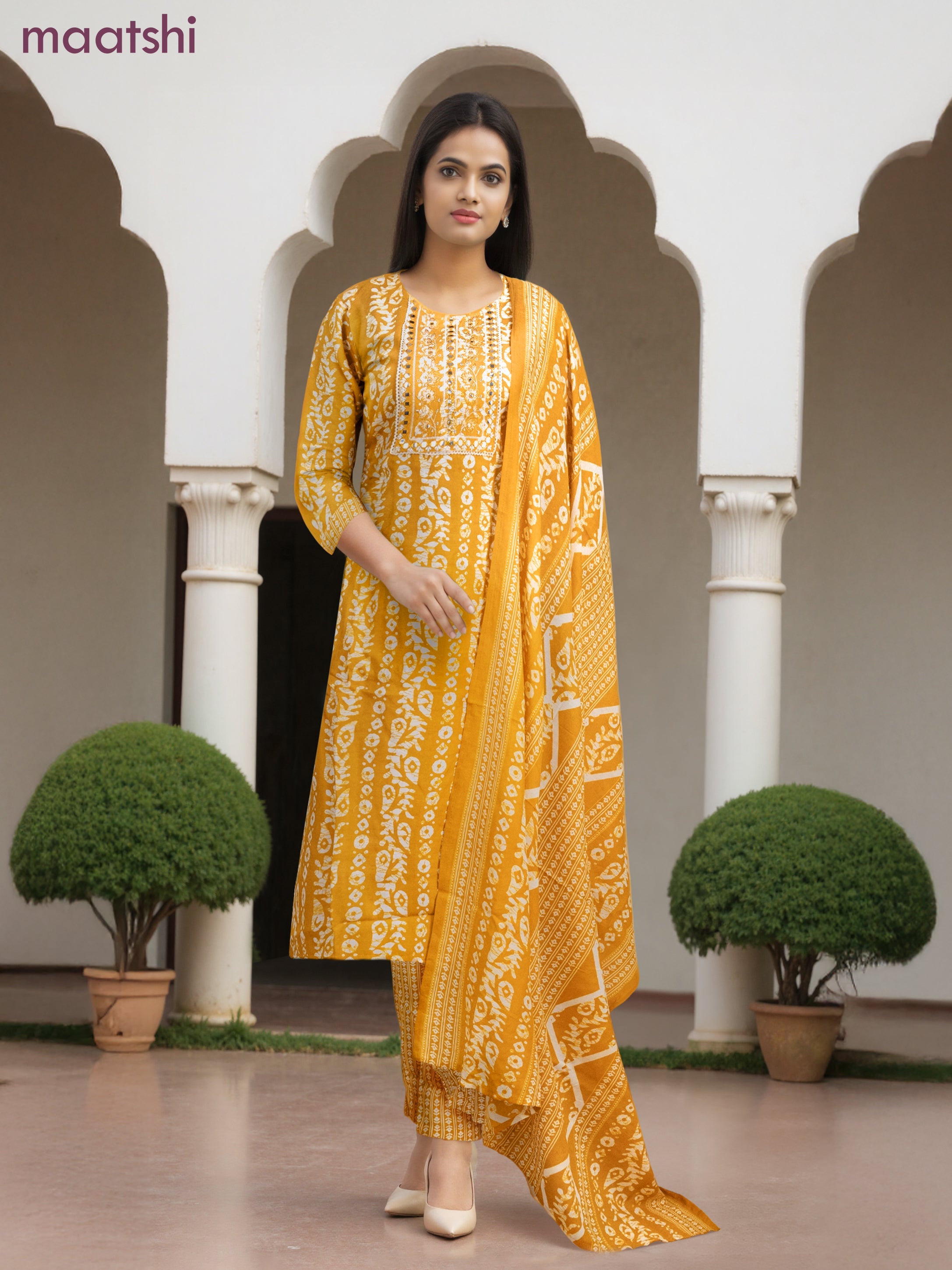 Cotton salwar suit mango yellow and off white with allover batik prints & embroidery lace work neck pattern and straight cut pant & dupatta