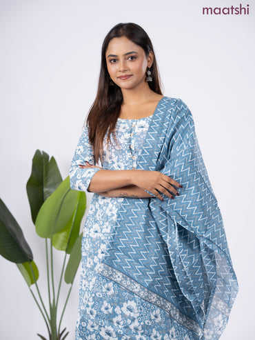 Semi cotton salwar suit bluish grey and off white with allover floral prints & simple neck pattern and straight cut pant & dupatta