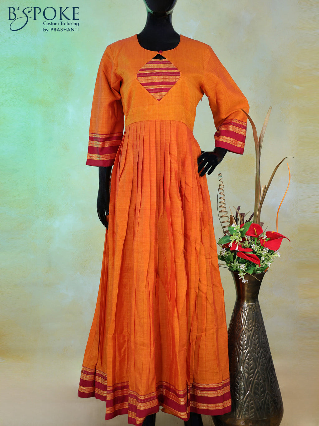 Narayanpet floor length kurti sunset orange and maroon with patch work neck pattern and zari woven border