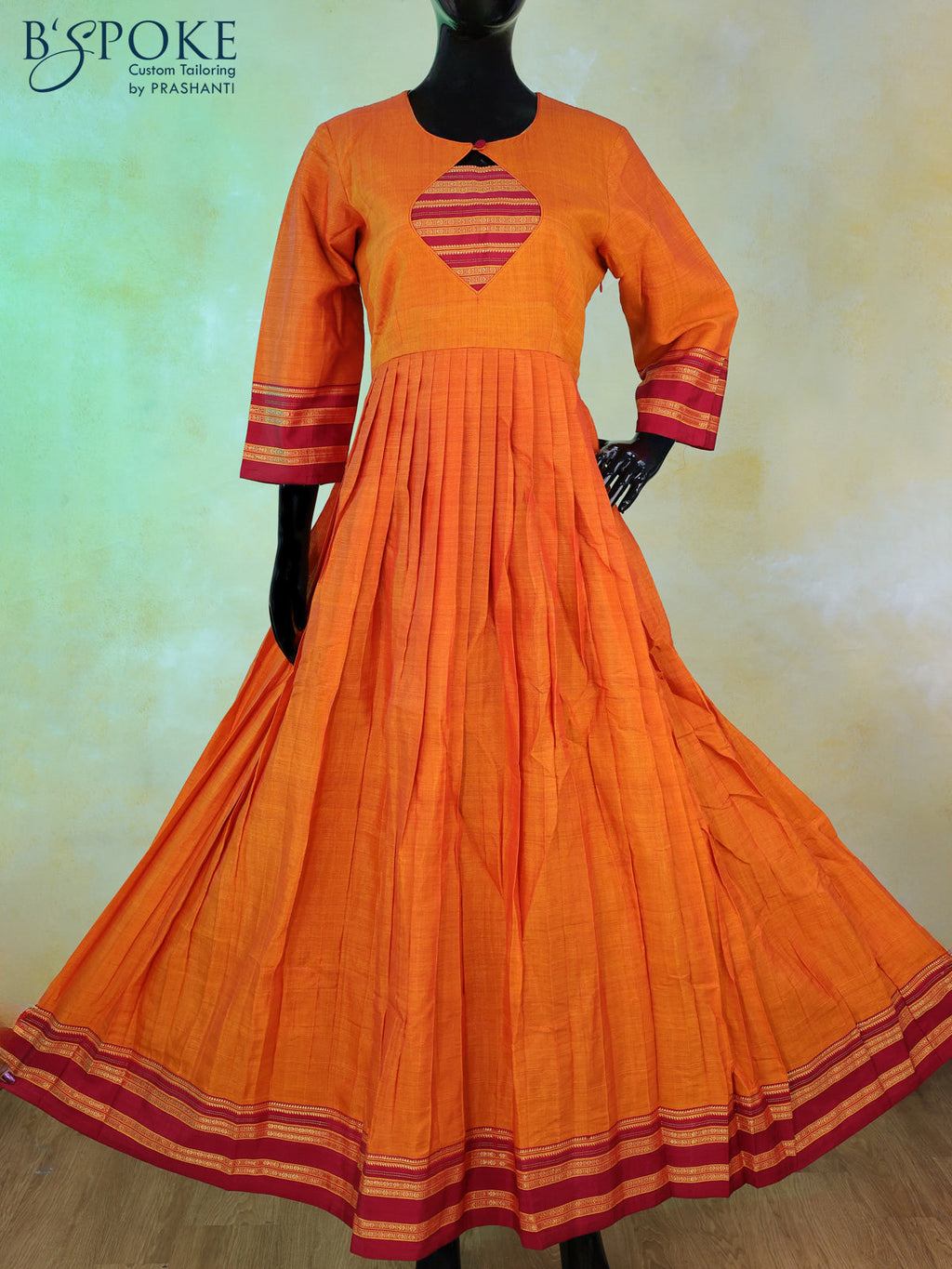 Narayanpet floor length kurti sunset orange and maroon with patch work neck pattern and zari woven border