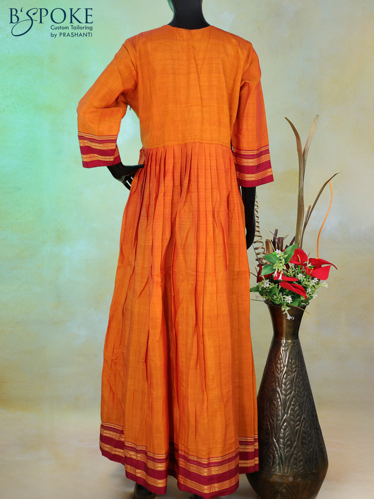 Narayanpet floor length kurti sunset orange and maroon with patch work neck pattern and zari woven border