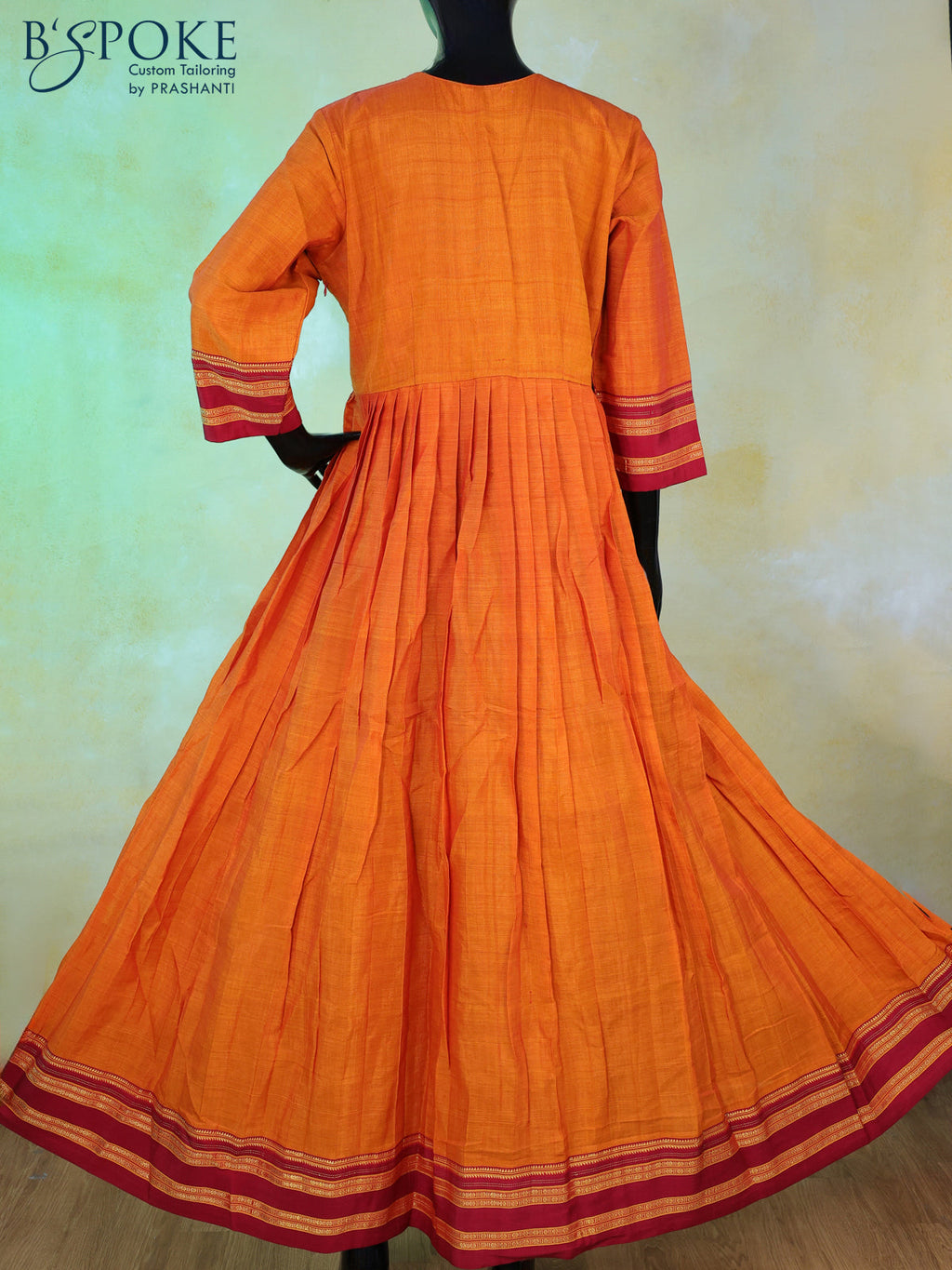 Narayanpet floor length kurti sunset orange and maroon with patch work neck pattern and zari woven border