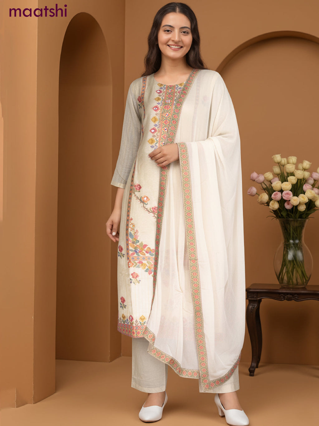 Chanderi salwar suit cream with ikat weaves & mirror work neck pattern and straight cut pant & chiffon dupatta