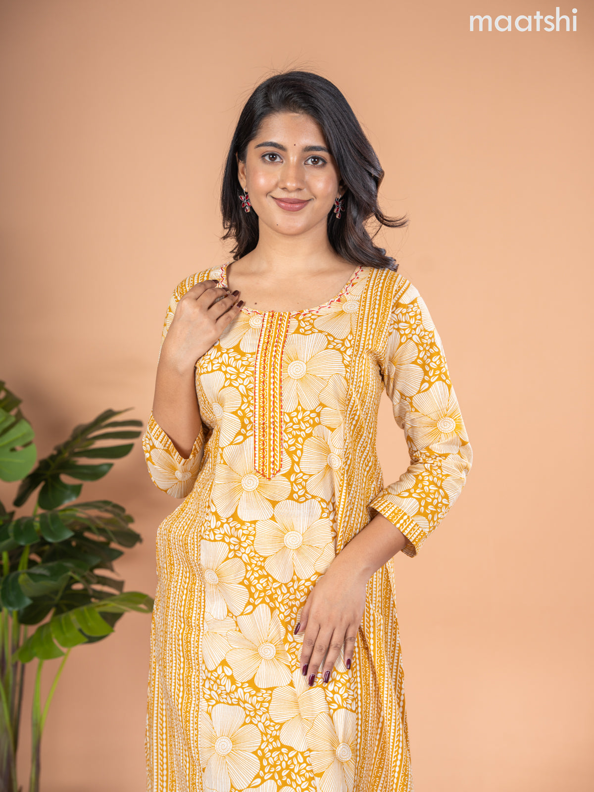 Cotton A-line kurti mustard yellow and off white with allover floral prints & kantha stitch work neck pattern without pant