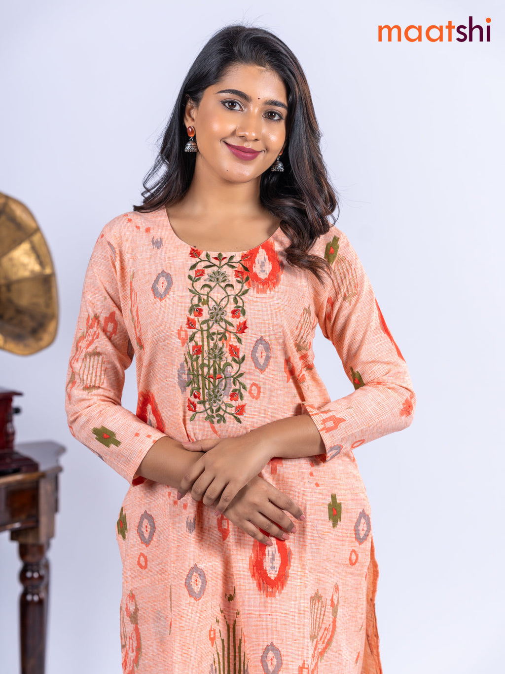 Cotton kurti set pale orange with allover ikat prints & embroidery work neck pattern and straight cut pant