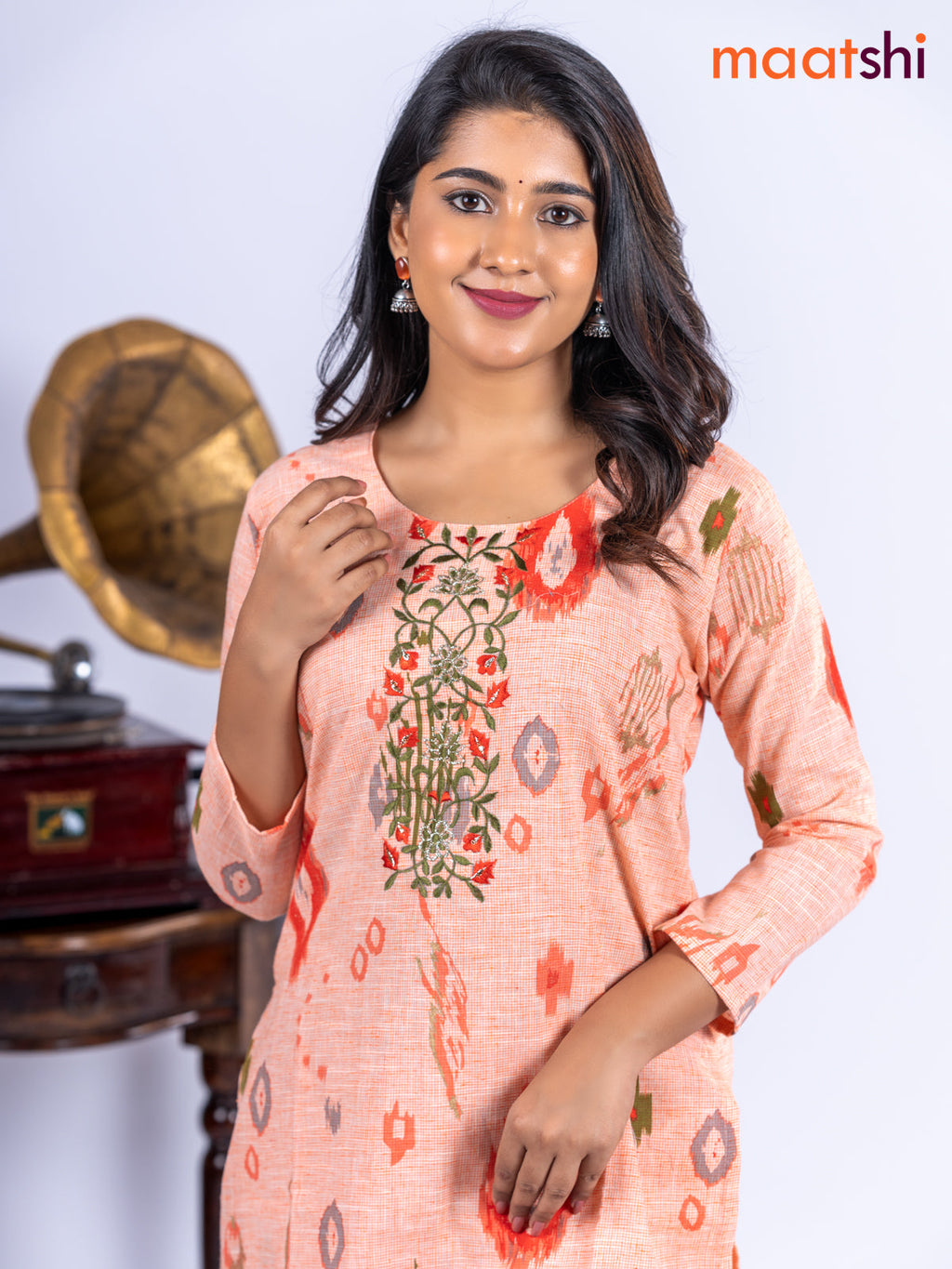 Cotton kurti set pale orange with allover ikat prints & embroidery work neck pattern and straight cut pant