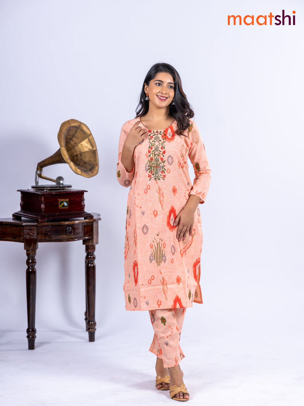 Cotton kurti set pale orange with allover ikat prints & embroidery work neck pattern and straight cut pant
