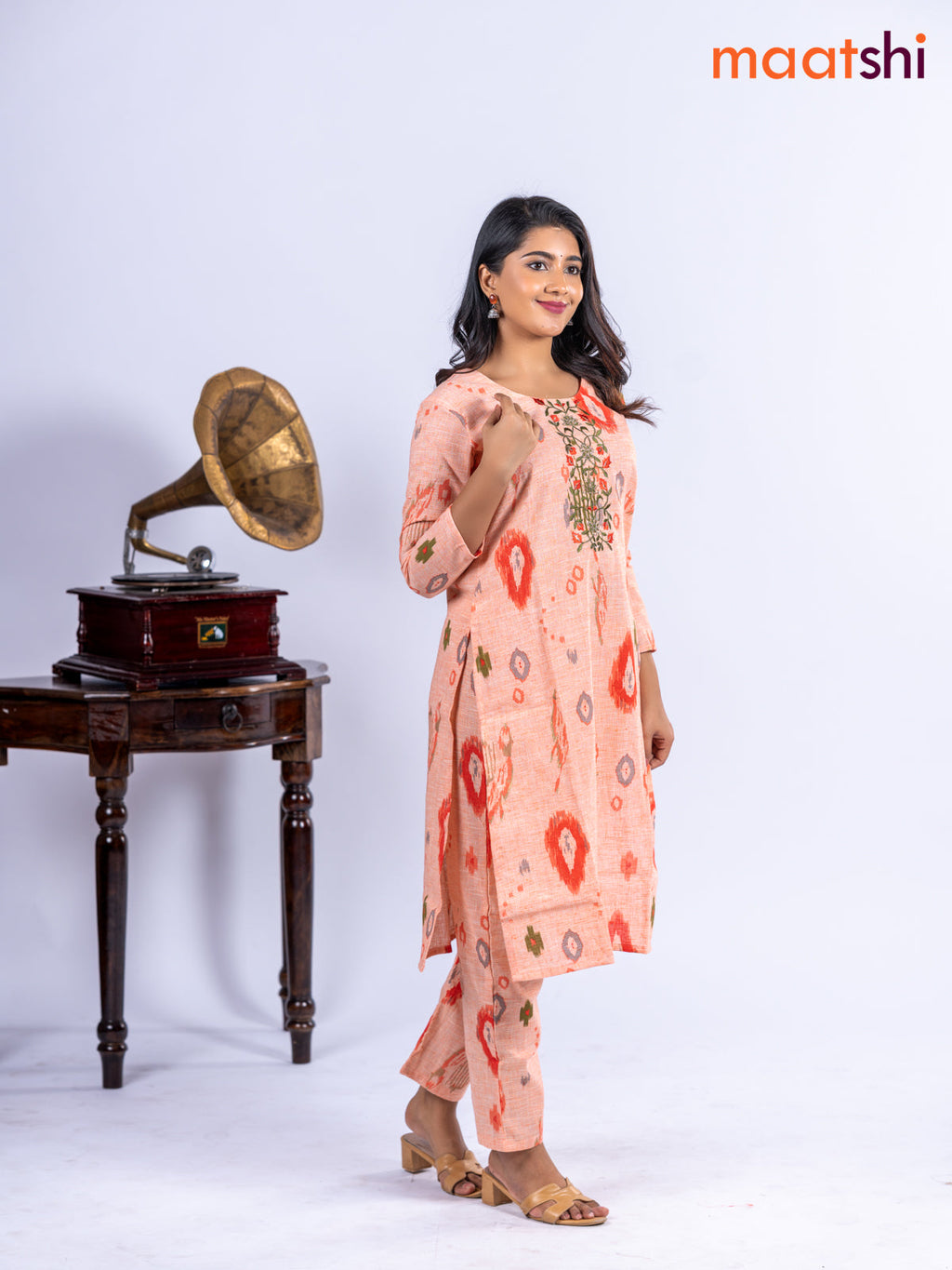 Cotton kurti set pale orange with allover ikat prints & embroidery work neck pattern and straight cut pant