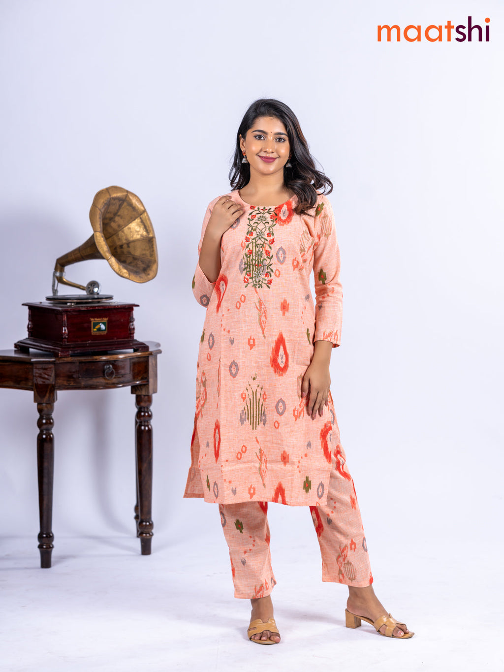 Cotton kurti set pale orange with allover ikat prints & embroidery work neck pattern and straight cut pant
