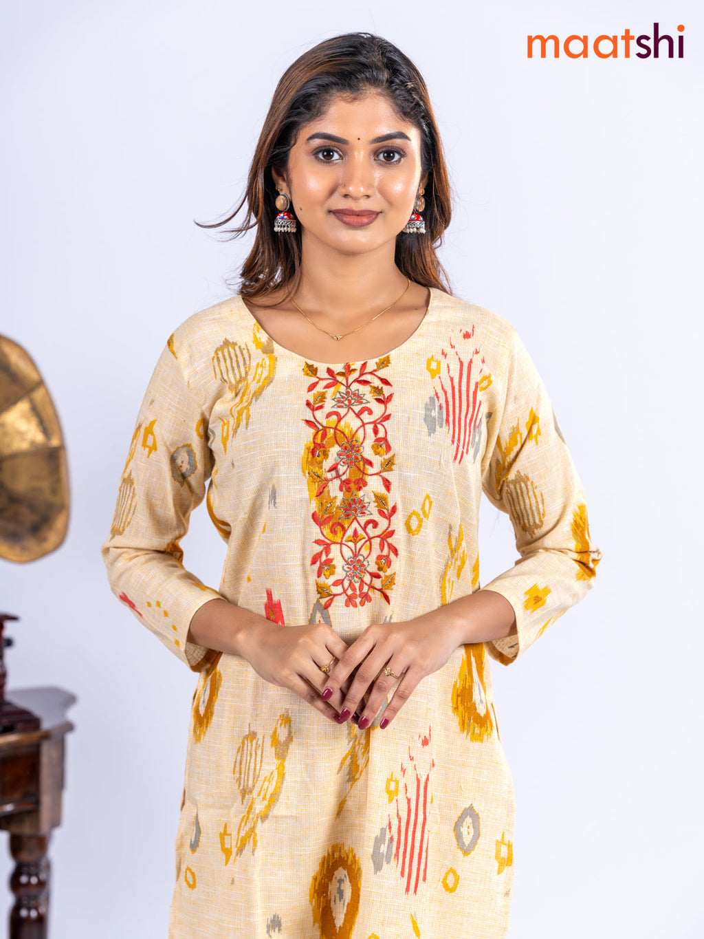 Cotton kurti set pale yellow with allover ikat prints & embroidery work neck pattern and straight cut pant