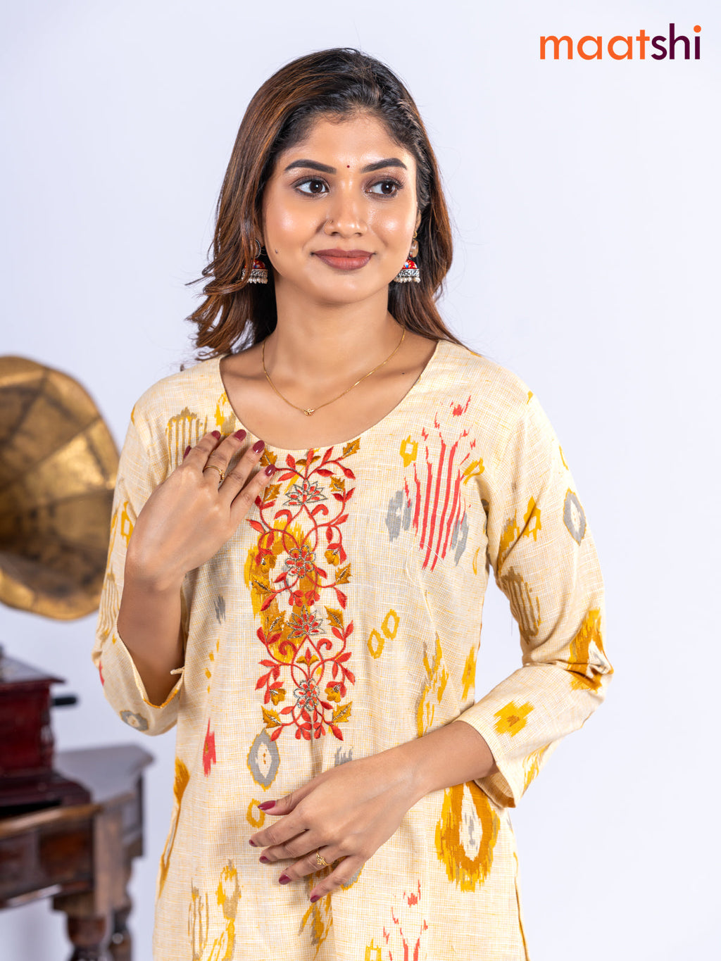 Cotton kurti set pale yellow with allover ikat prints & embroidery work neck pattern and straight cut pant