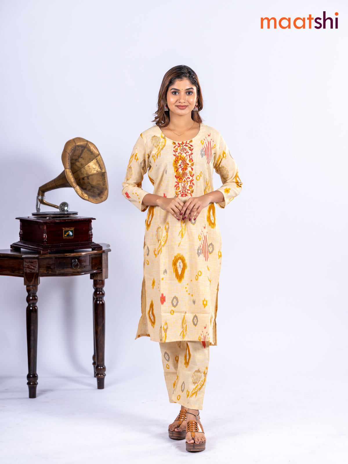 Cotton kurti set pale yellow with allover ikat prints & embroidery work neck pattern and straight cut pant