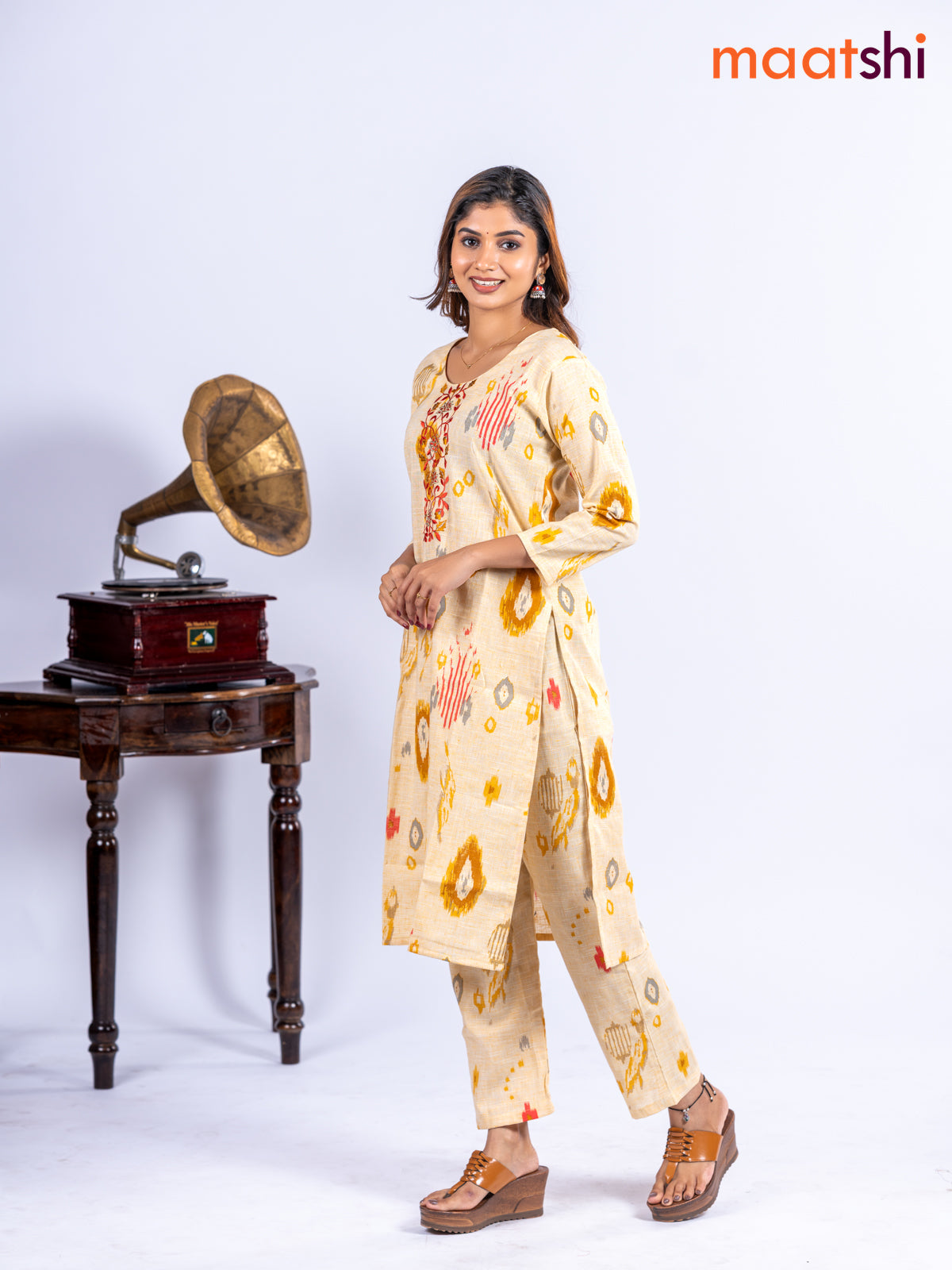 Cotton kurti set pale yellow with allover ikat prints & embroidery work neck pattern and straight cut pant