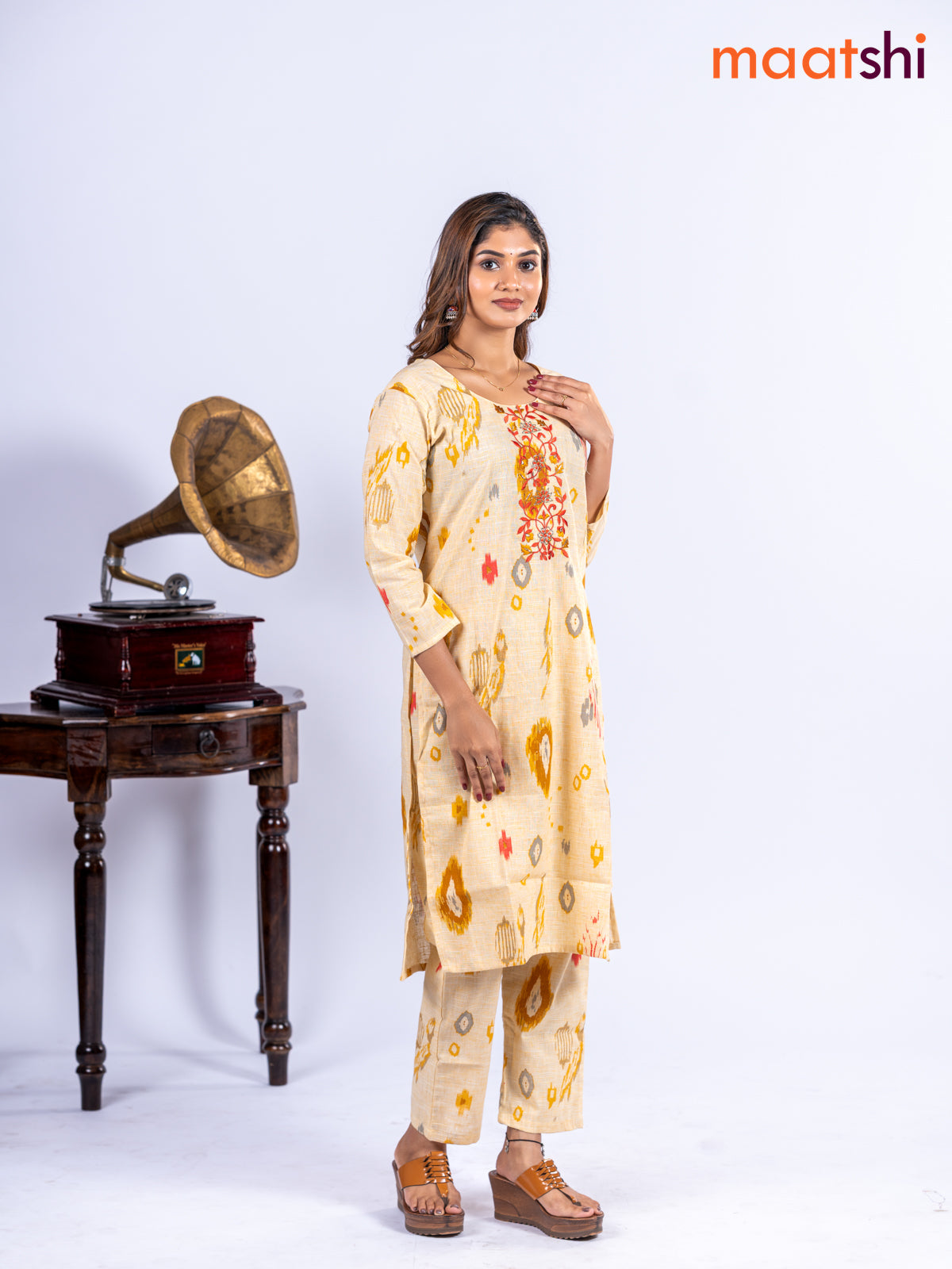 Cotton kurti set pale yellow with allover ikat prints & embroidery work neck pattern and straight cut pant