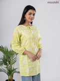 Cotton short kurti lime green and off white with allover prints & simple neck pattern without pant