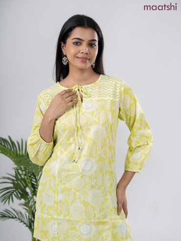 Cotton short kurti lime green and off white with allover prints & simple neck pattern without pant