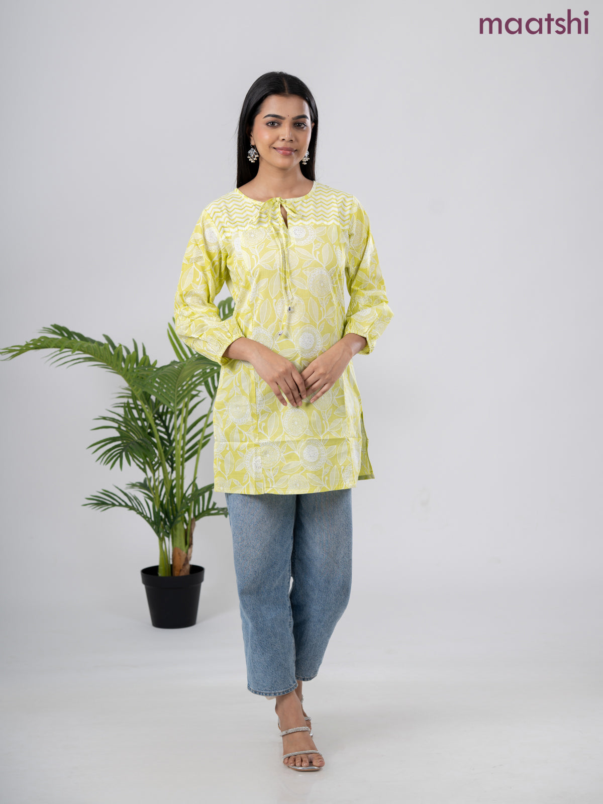 Cotton short kurti lime green and off white with allover prints & simple neck pattern without pant