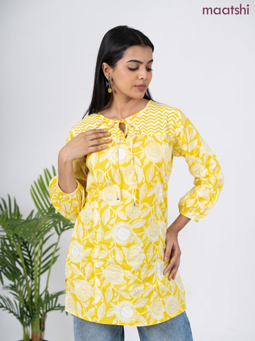 Cotton short kurti yellow and off white with allover prints & simple neck pattern without pant