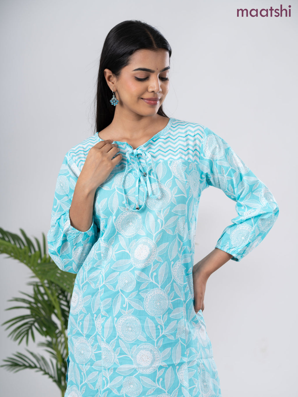 Cotton short kurti light blue and off white with allover prints & simple neck pattern without pant