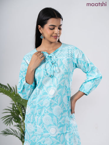 Cotton short kurti light blue and off white with allover prints & simple neck pattern without pant