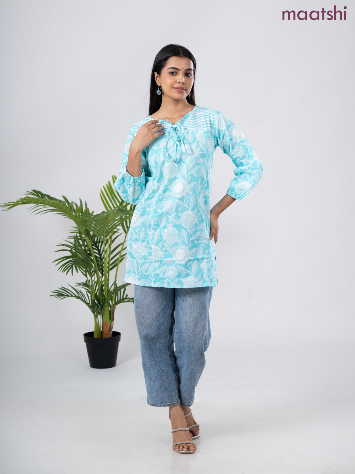 Cotton short kurti light blue and off white with allover prints & simple neck pattern without pant