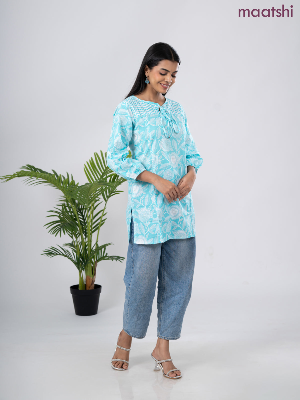Cotton short kurti light blue and off white with allover prints & simple neck pattern without pant