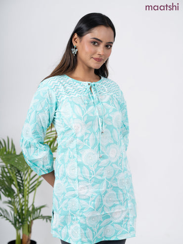 Cotton short kurti teal blue and off white with allover prints & simple neck pattern without pant