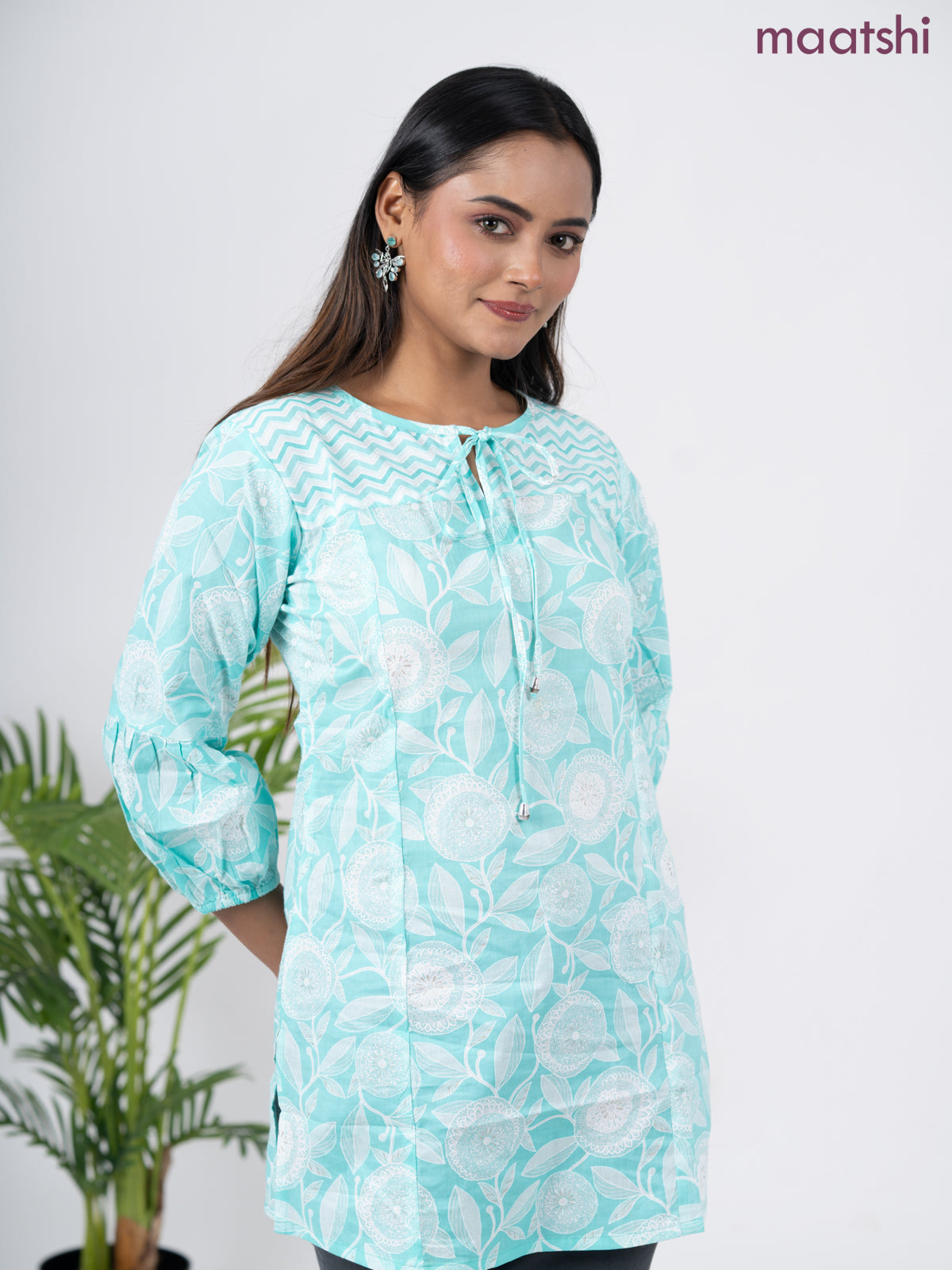 Cotton short kurti teal blue and off white with allover prints & simple neck pattern without pant