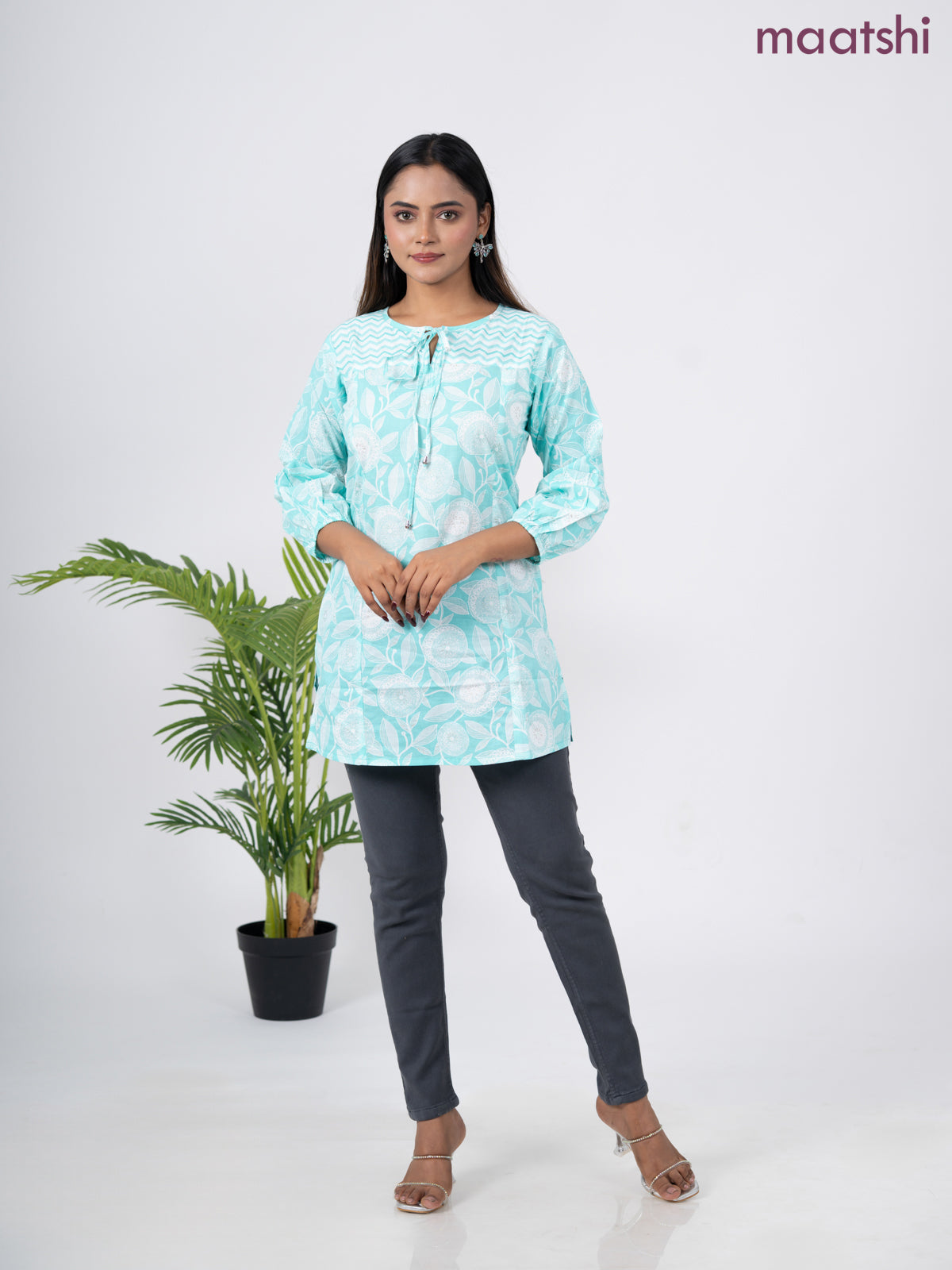 Cotton short kurti teal blue and off white with allover prints & simple neck pattern without pant